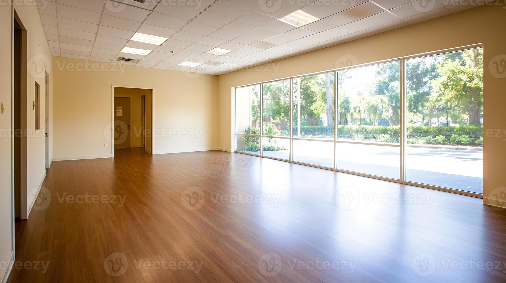 Vacant Office Space with Spacious Wooden Flooring and Panoramic Windows photo