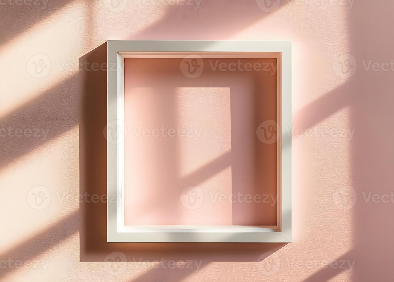 White Frame Against A Pink Wall In Sunlight photo
