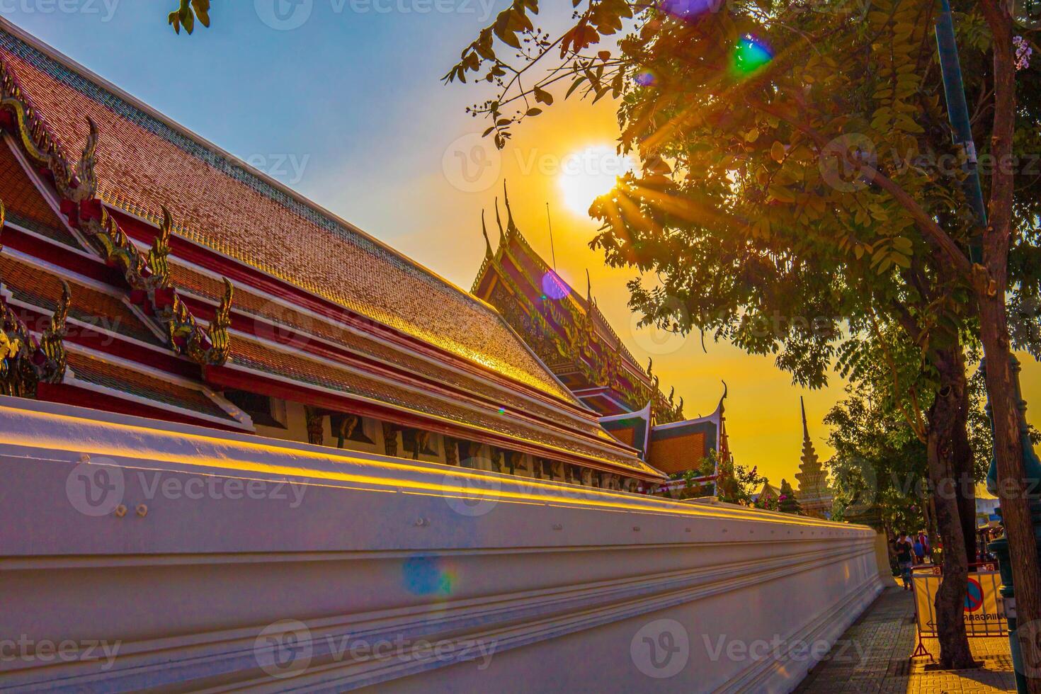 The beautiful sun set over Wat Pho temple, Thailand. photo