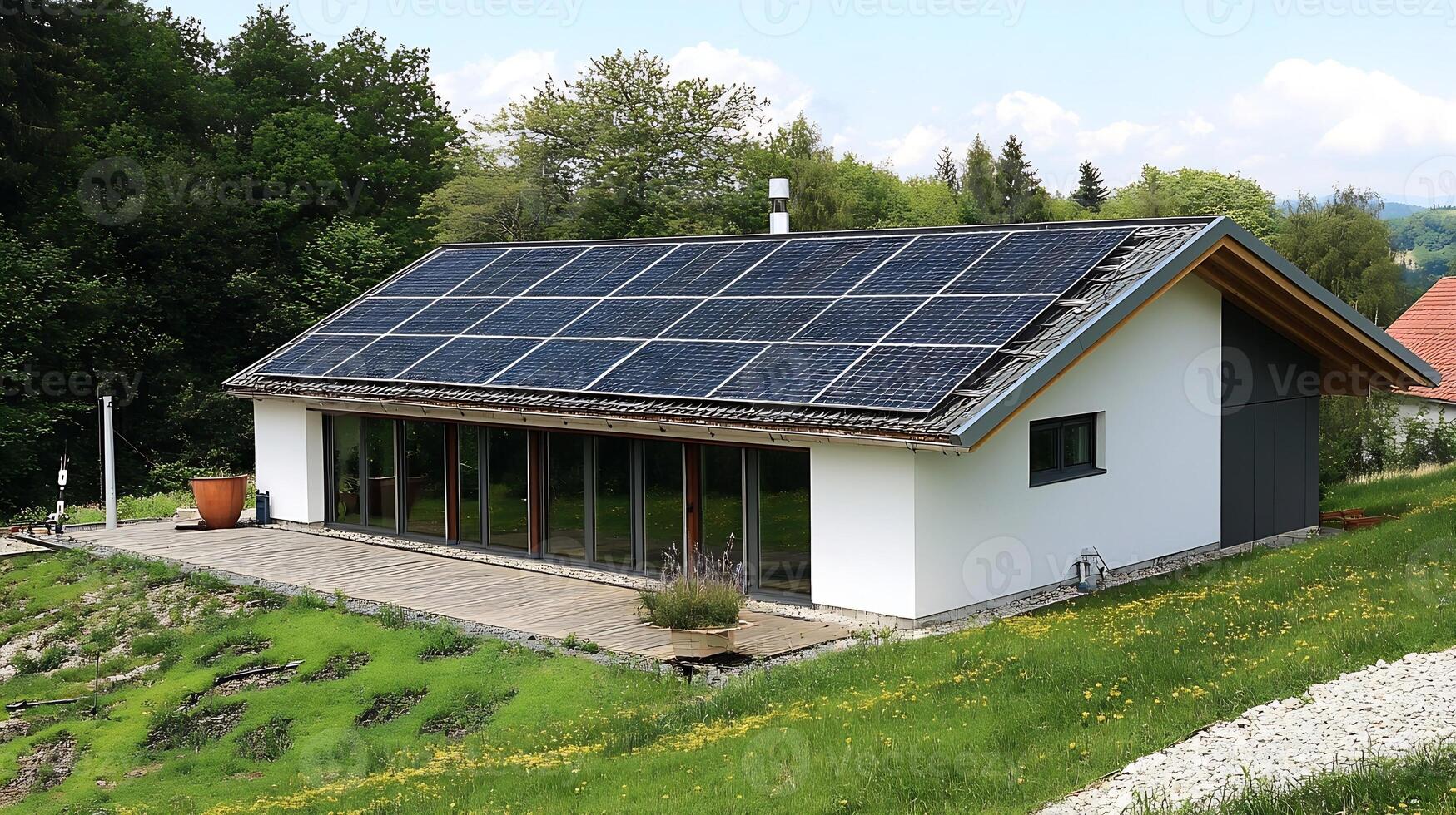 Eco-Friendly Modern House with Solar Panels in Lush Countryside Landscape photo