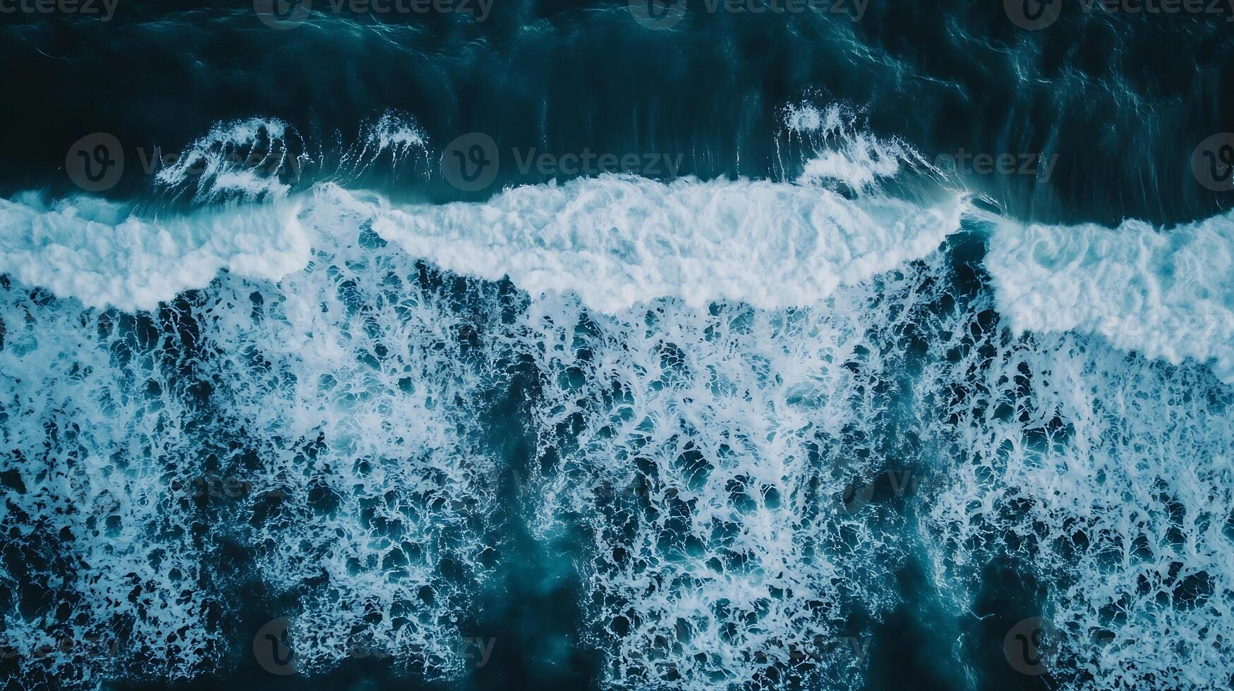 Aerial View of Crashing Ocean Waves with Turquoise Tones and White Foam Patterns photo