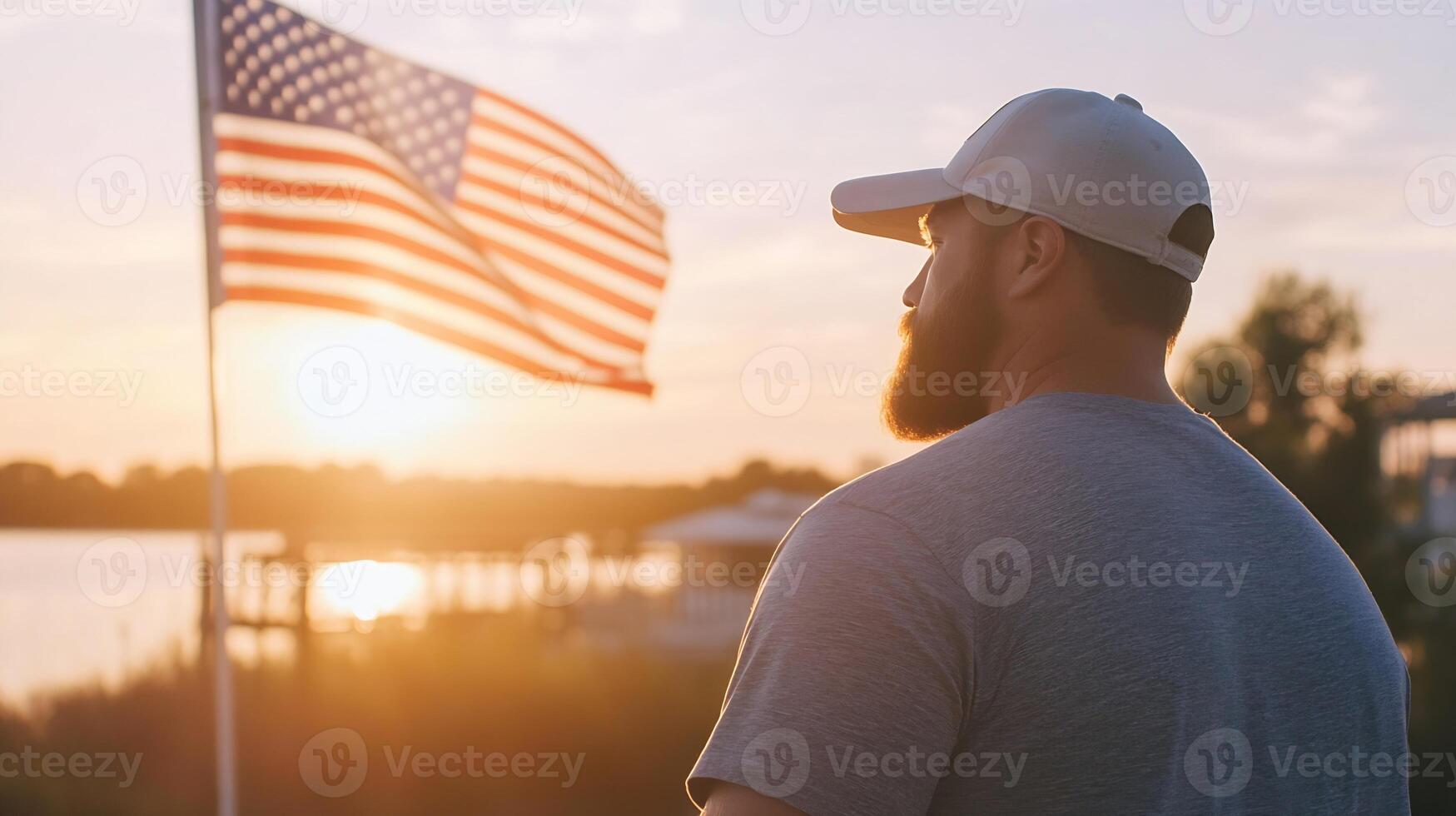 Man Reflecting at Sunset with American Flag in Beautiful Tranquil Setting photo