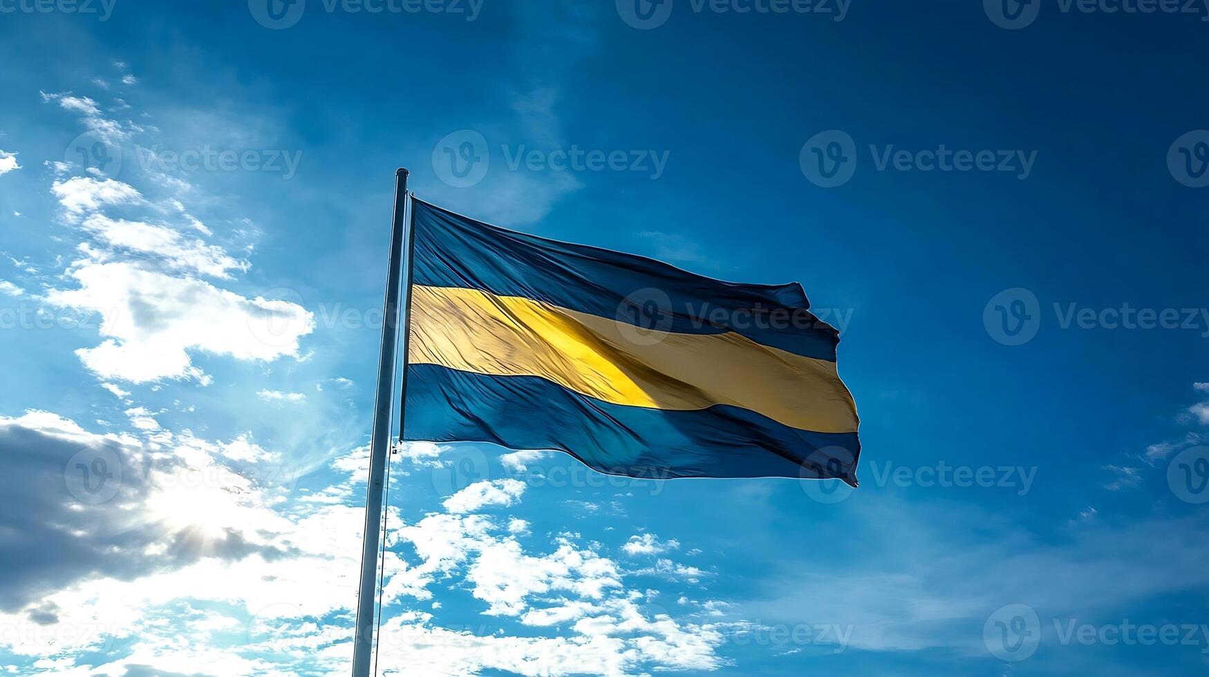 Vibrant National Flag with Yellow Stripe Against Blue Sky in a Majestic Display photo