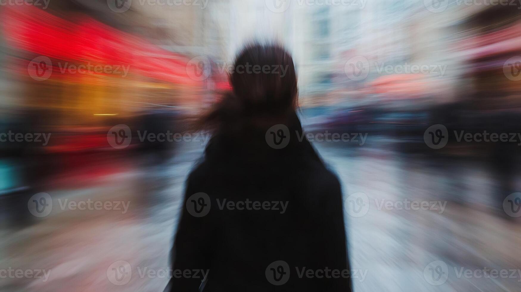 Blurred motion capture of person in urban street with vivid color lights photo