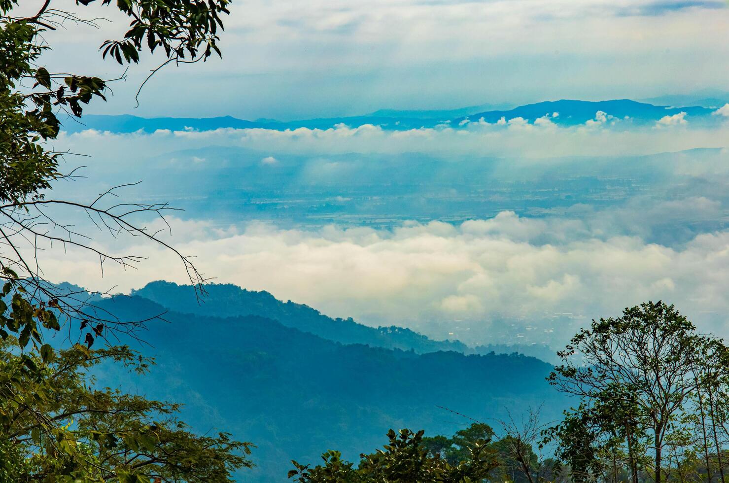 Foggy sky with the layers of mountains. photo