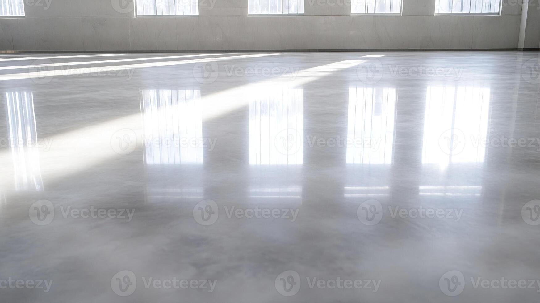 Polished Concrete Floor in Spacious Room with Natural Light Streaming Through Large Windows photo