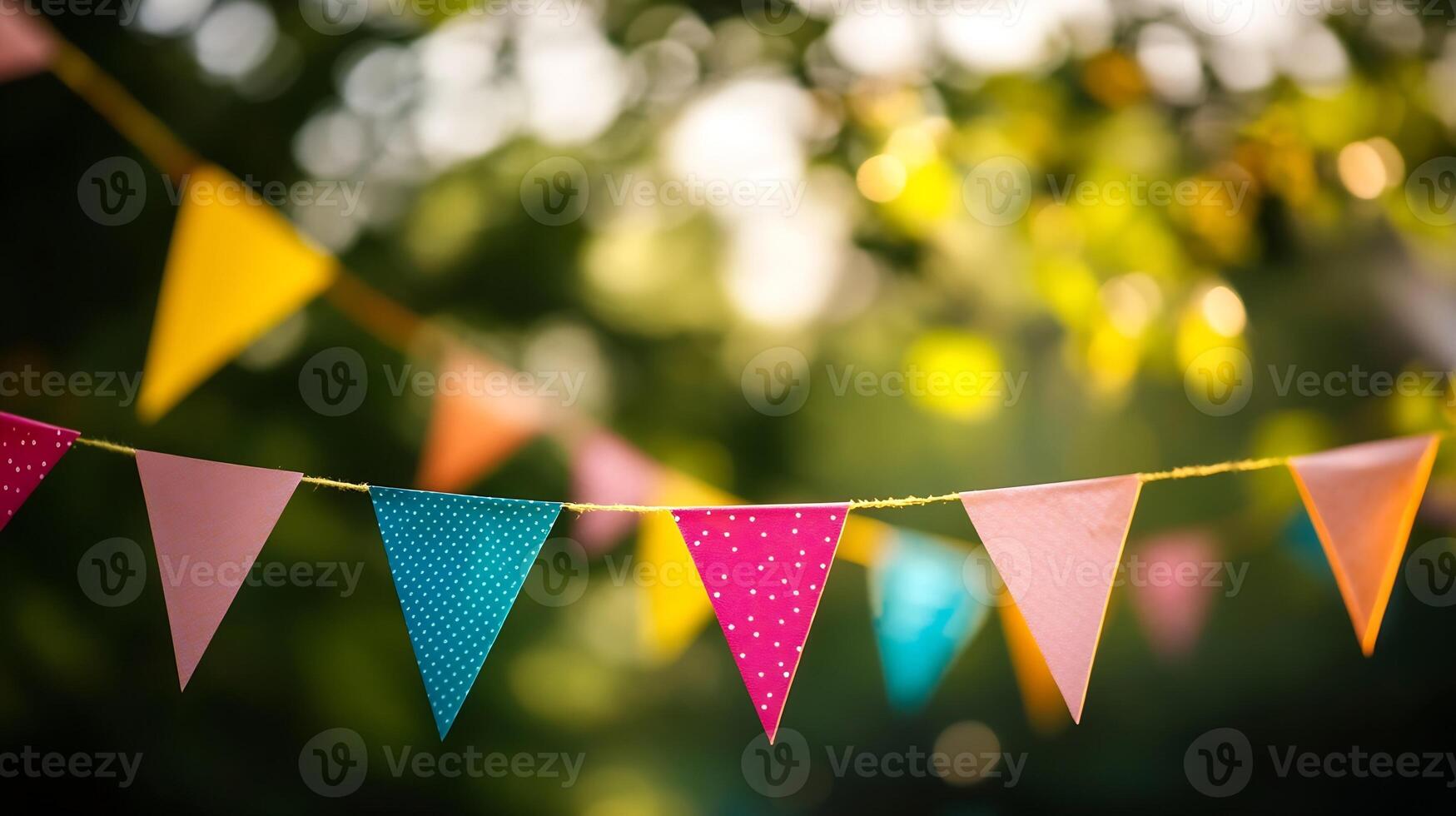 Cheerful colorful party bunting flags hanging in sunny garden creating festive atmosphere for events photo