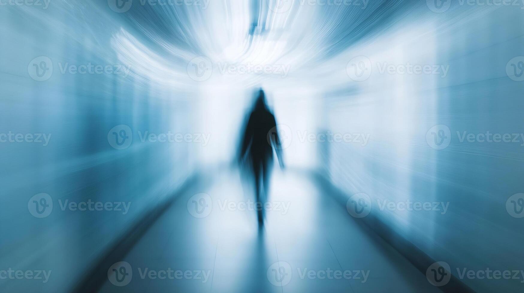 Mysterious Outlines of a Figure in a Blurred Blue Corridor Creating a Sense of Wonder photo