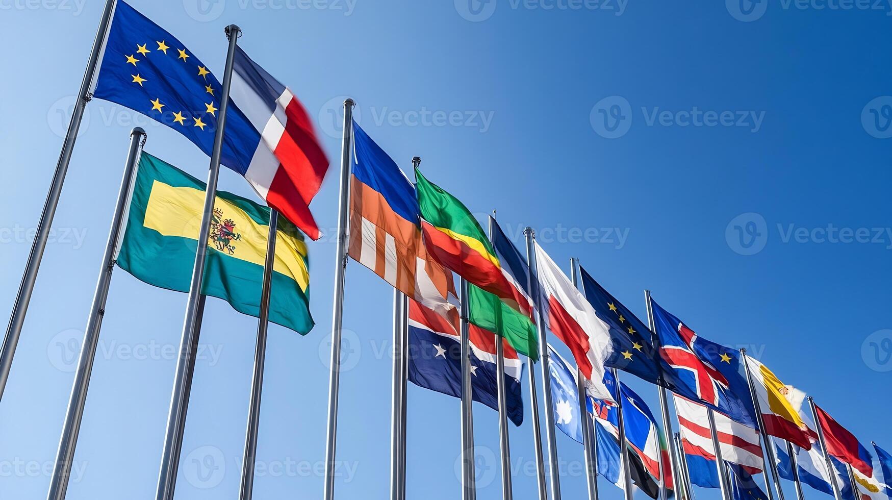Diverse International Flags Waving Against Clear Blue Sky Symbolizing Global Unity and Cooperation photo