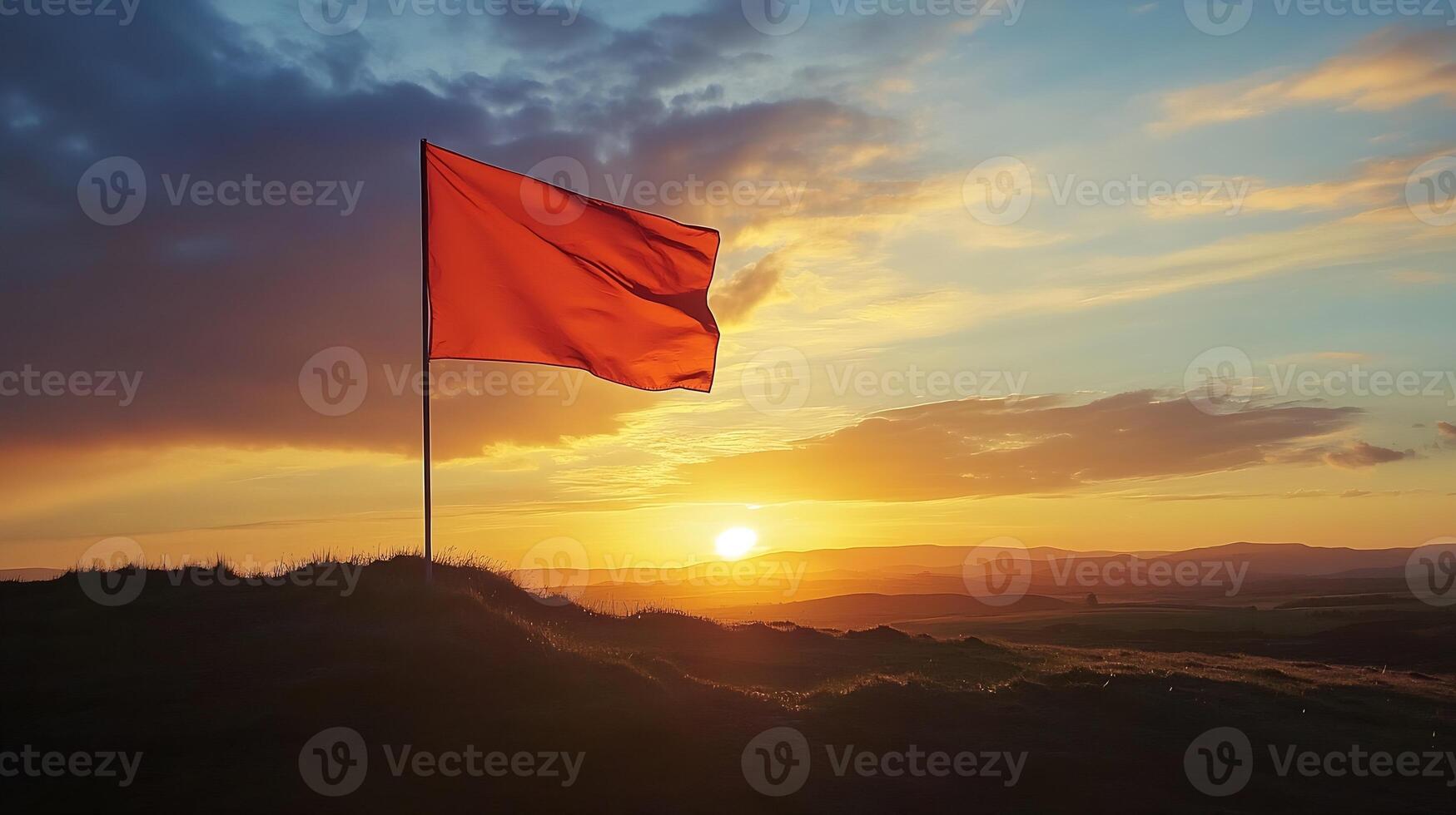Serene Sunset with a Flag on Hilltop at a Majestic Horizon in a Calm Evening photo