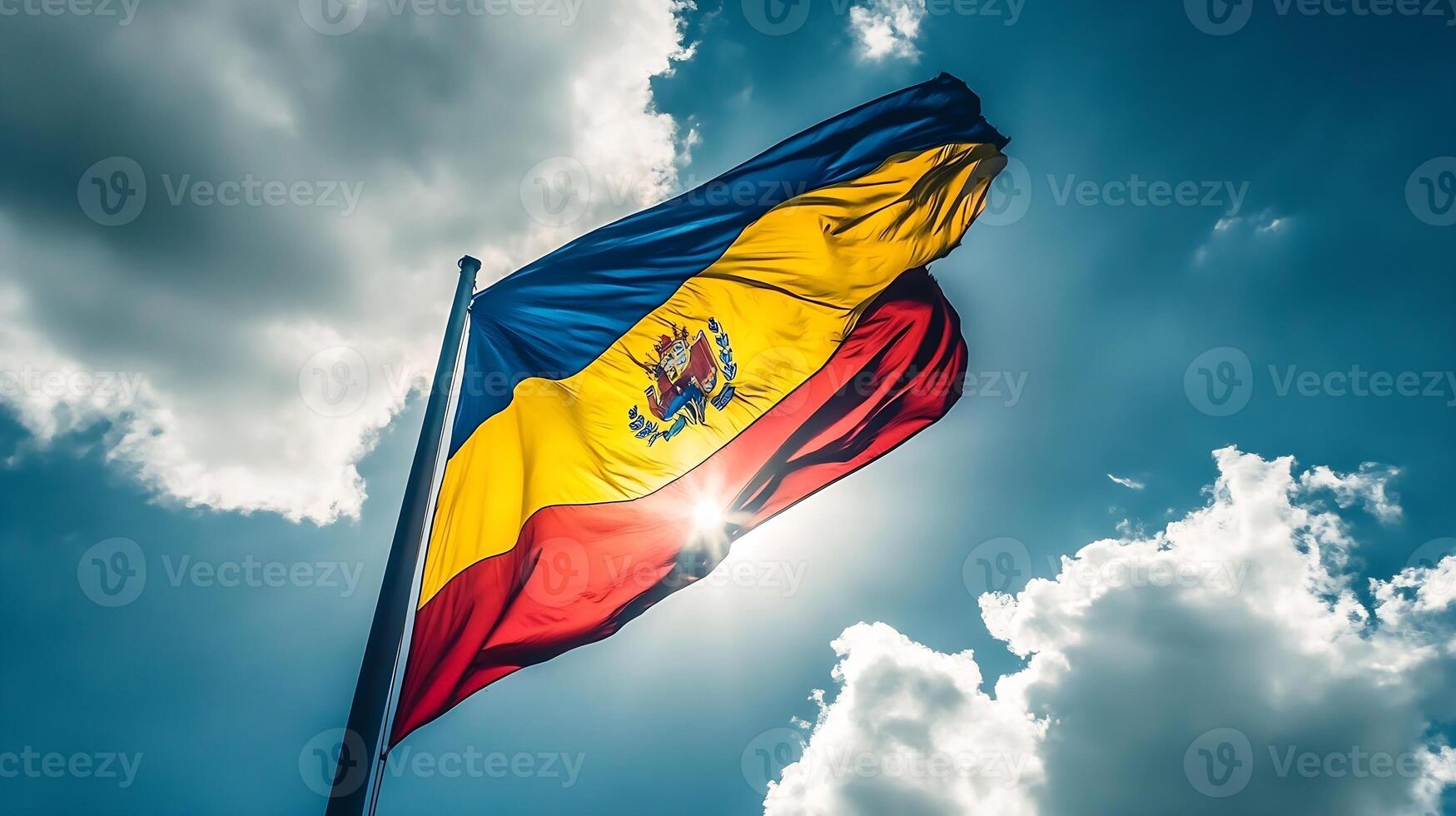 Andorra Flag Waving High Against Bright Blue Sky with White Clouds photo