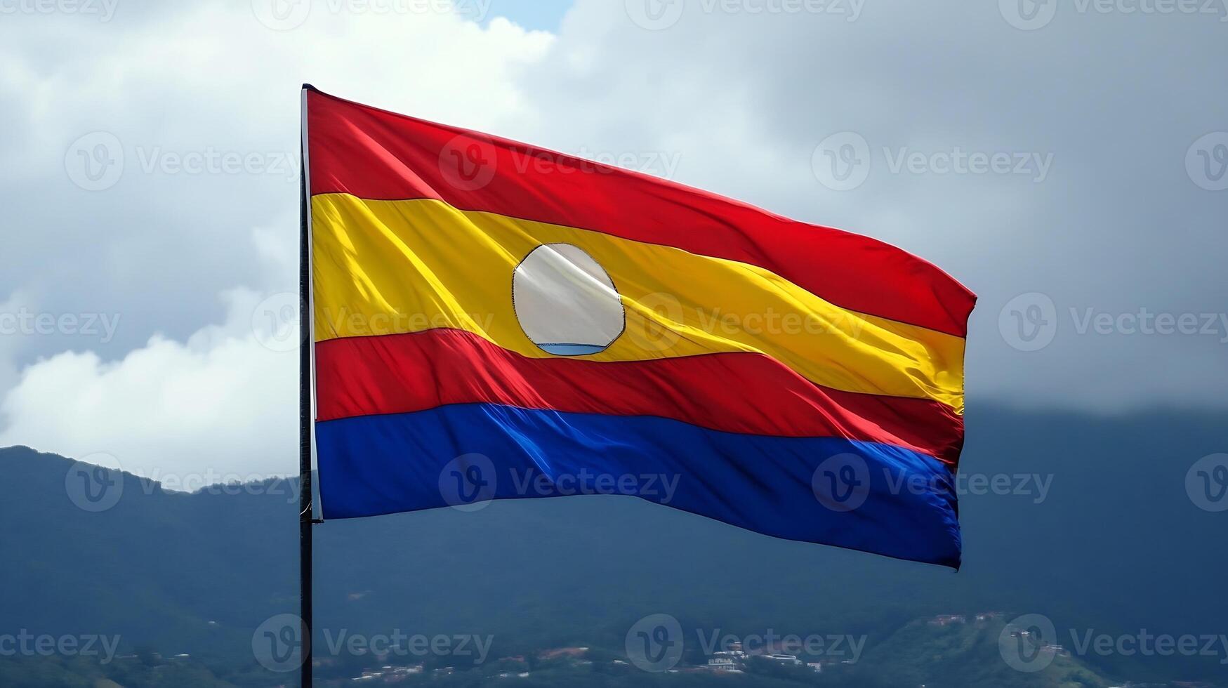 Vibrant National Flag Waving Against Mountainous Landscape and Cloudy Skies photo