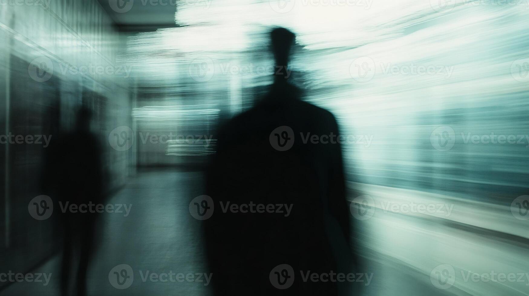 Abstract Blur of Figures in Motion in Urban Setting with Cool Blue Tones and Dynamic Movement photo