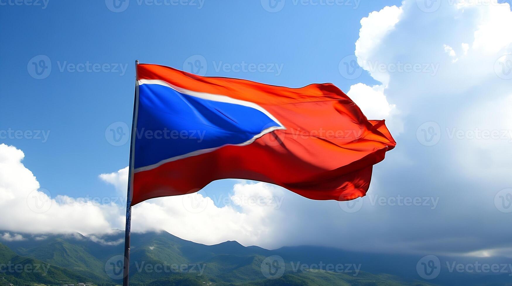 Vibrant Flag Waving Against Clear Blue Sky Representing National Pride photo