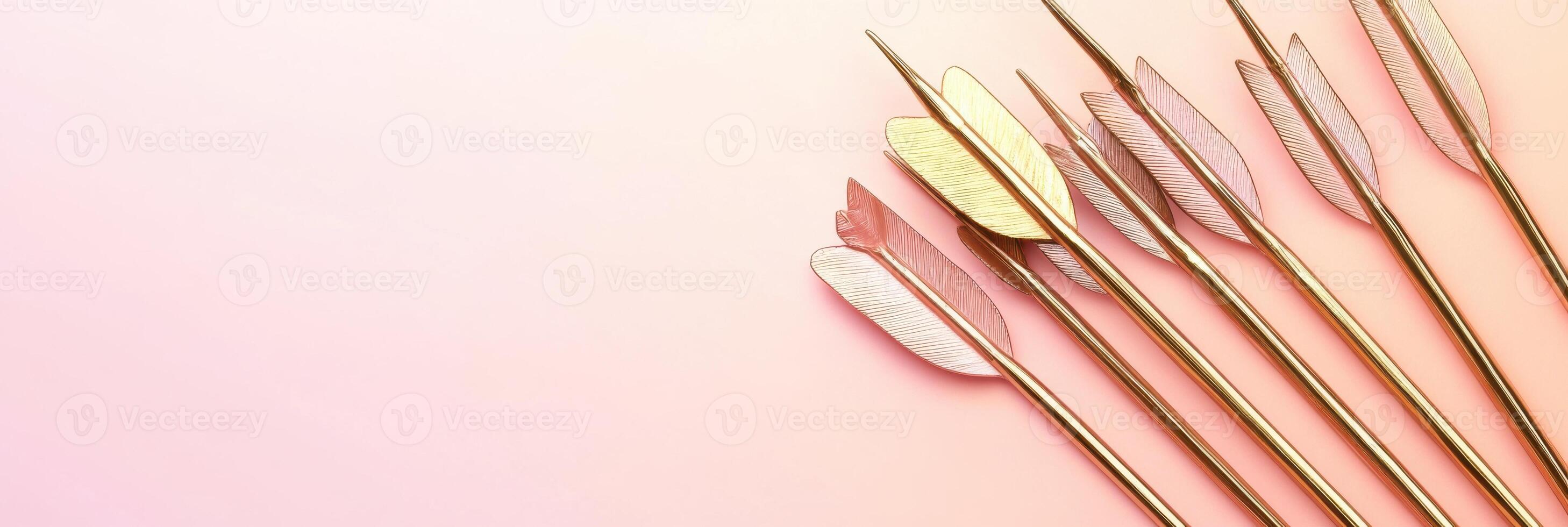 Decorative arrow feathers on pink gradient background for creative projects photo