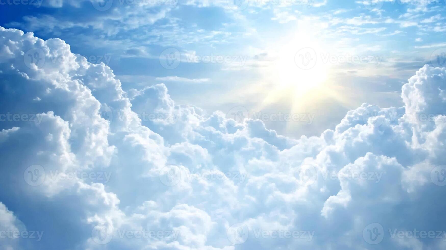 Bright blue sky with sun shining through fluffy white clouds creating a heavenly scene photo