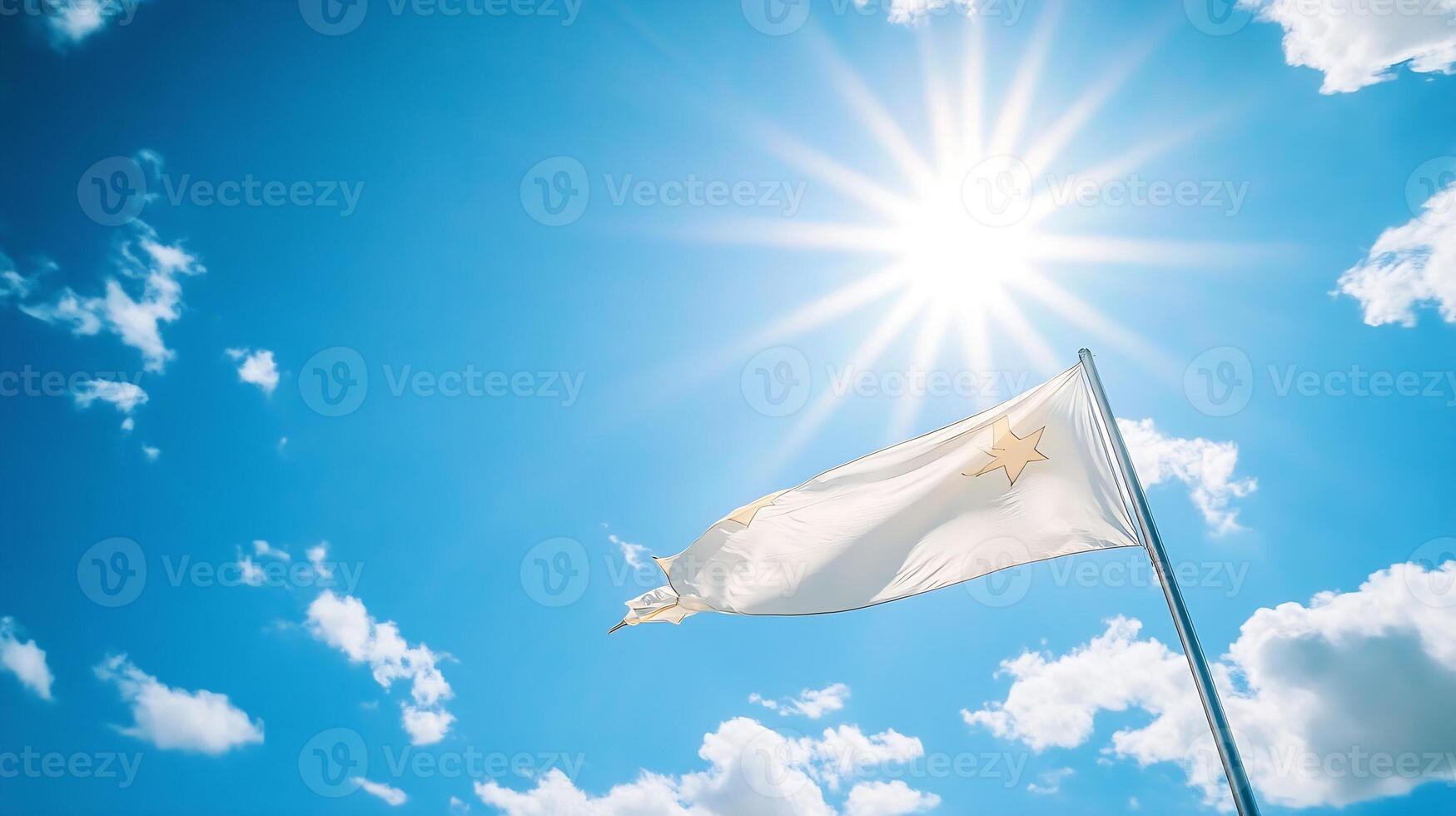 Vibrant Flag Waving Under Clear Blue Sky with Bright Sunlight and Fluffy White Clouds photo