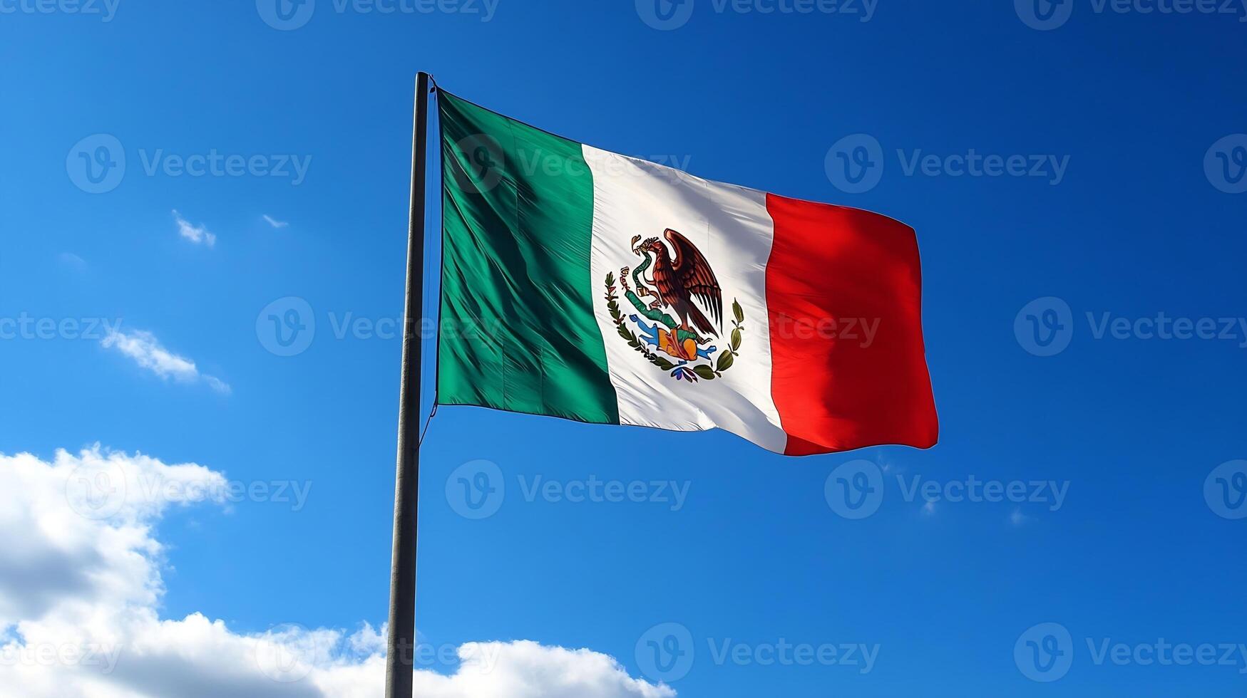 Vibrant Mexican Flag Waving under Clear Blue Sky photo