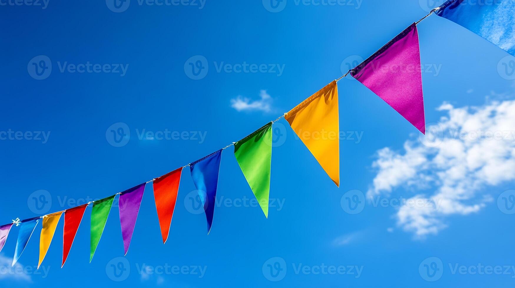 Colorful Festival Flags in Bright Blue Sky Create Lively and Festive Atmosphere photo