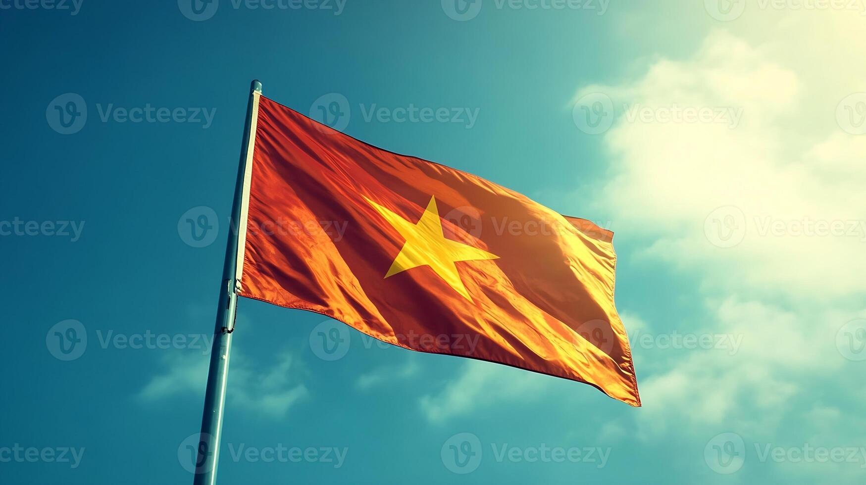 Vietnam Flag Waving Against Clear Blue Sky With Bright Sunlight Illuminating National Colors photo
