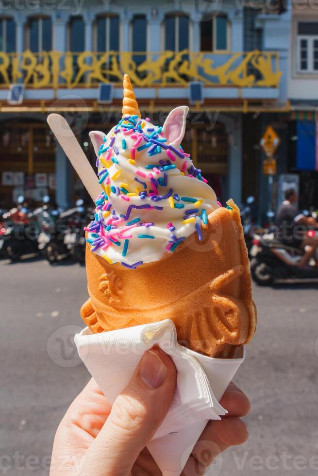 Unicorn Themed Ice Cream Cone with Fish Shaped Cone in Phuket Street photo