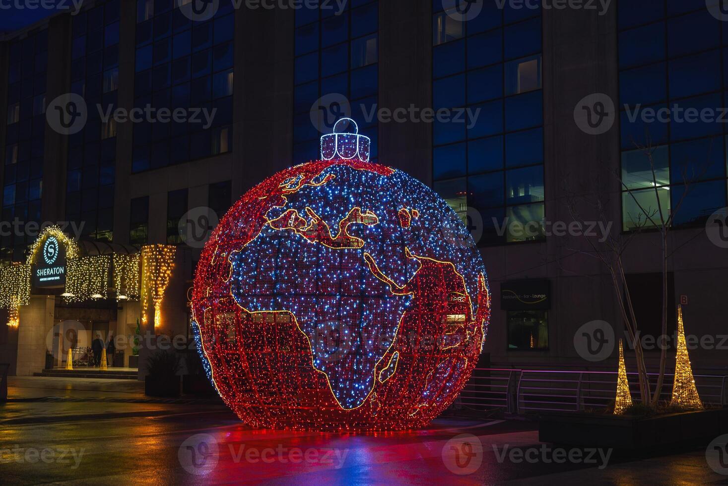 Illuminated Globe Decoration and Festive Lights at Night Near Sheraton Hotel photo