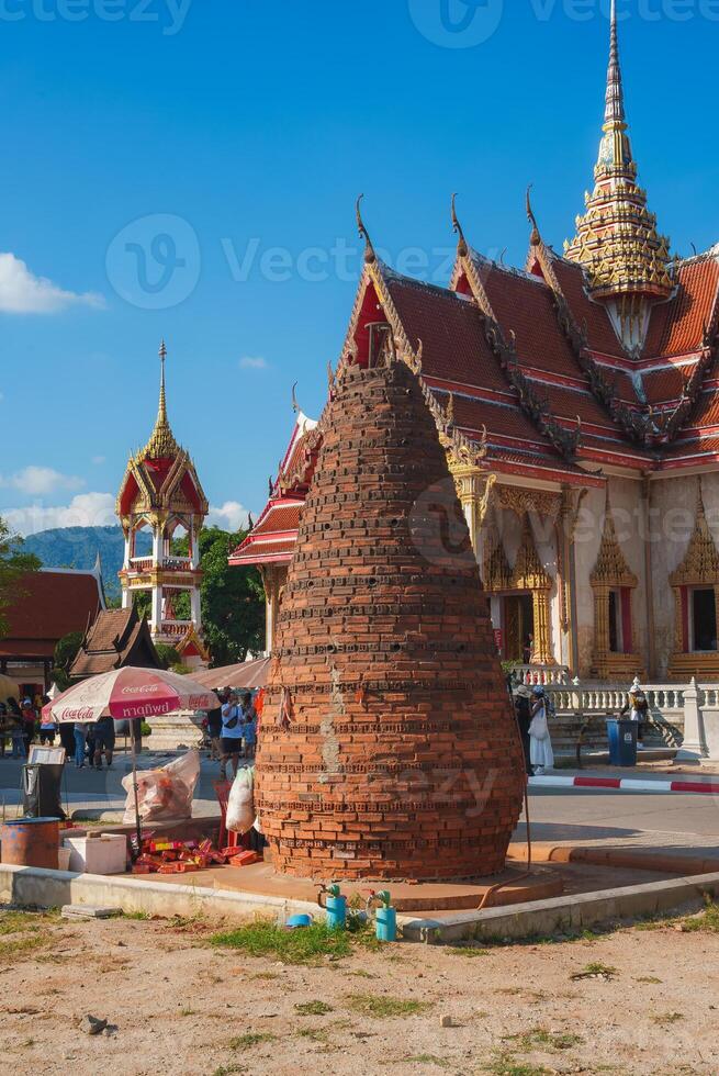 Wat Chalong Temple with Ornate Spire and Lively Grounds in Phuket photo
