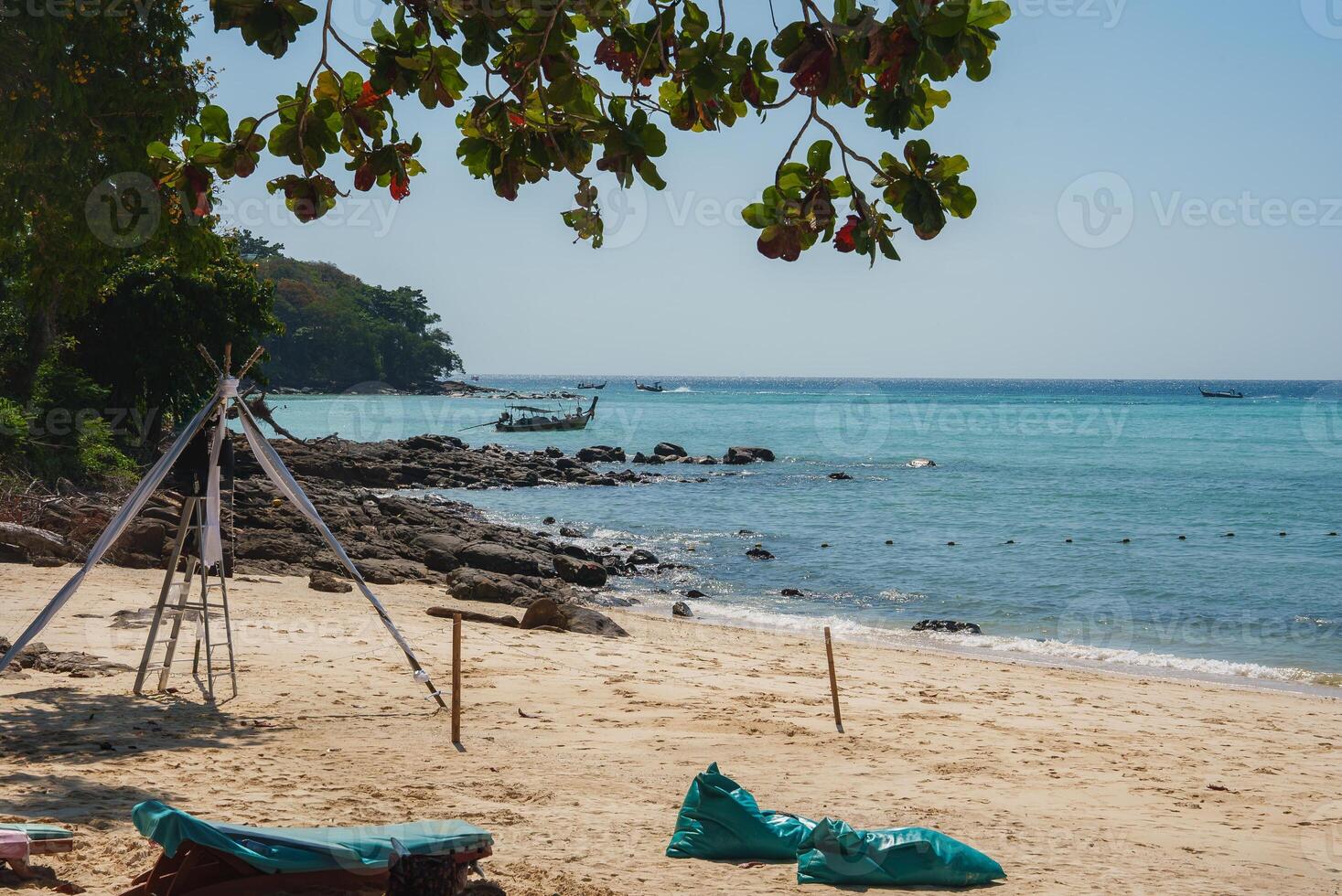 Serene Beach Scene with Long Tail Boats in Phuket, Thailand photo