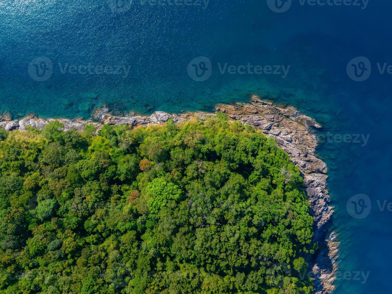 op View of Rocks in Camburi Beach, Sao Paulo, Brazil. Clear water reveals underwater terrain near the coast in Brazil. photo
