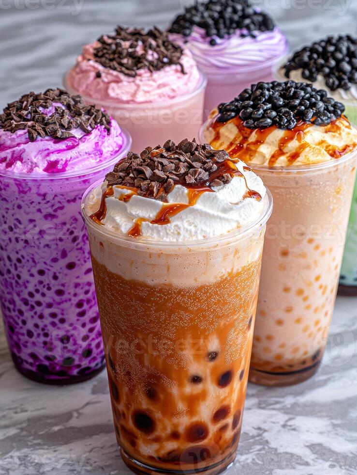 Close up of several bubble tea drinks with various toppings photo