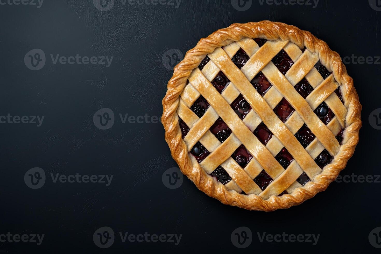 Delicious berry pie with lattice crust on dark background photo