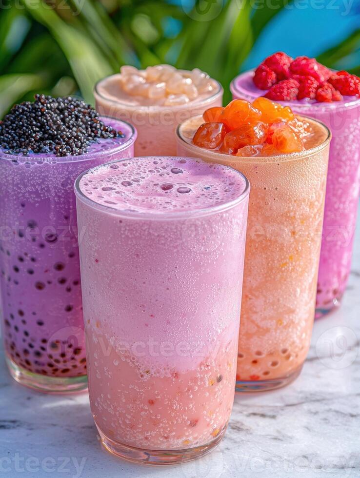 Assortment of colorful bubble tea drinks with tapioca pearls photo