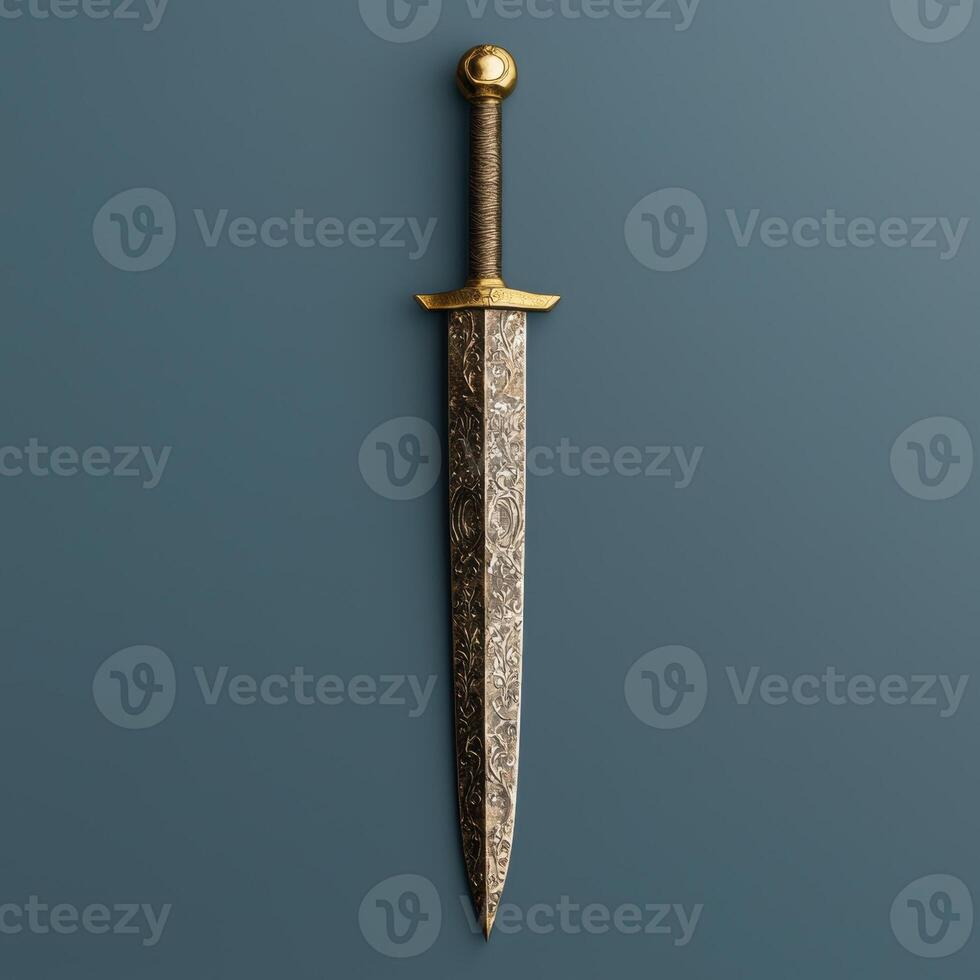 Ornate dagger with gold accents on a blue background photo