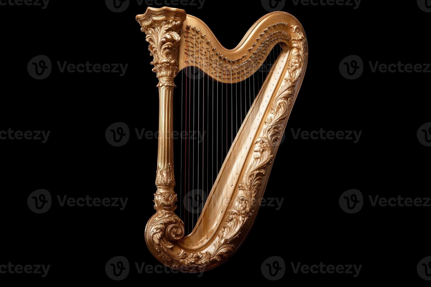 Ornate golden harp against a black background photo