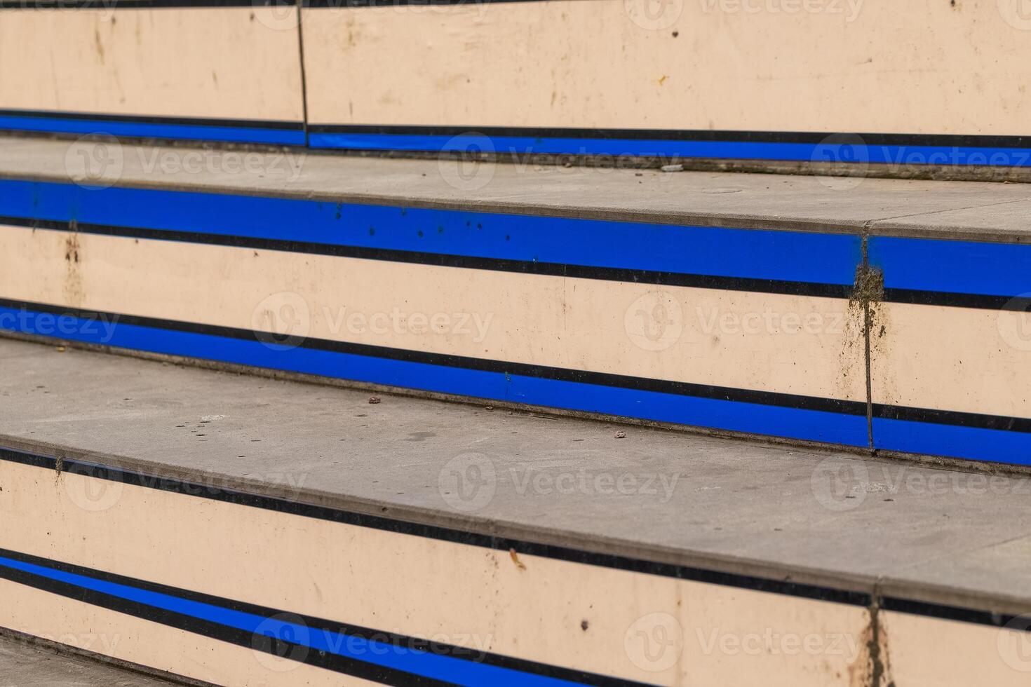 Steps with blue lines leading to an urban area in bright daylight showcasing a modern architectural design photo