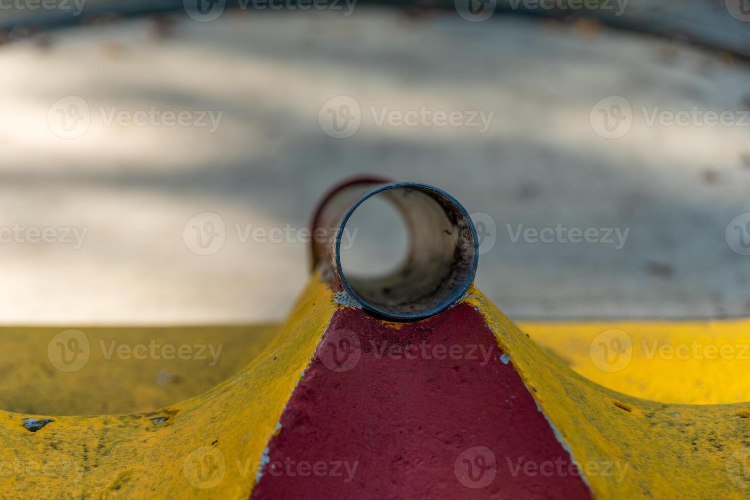 Unusual perspective of colorful playground equipment in a park during bright daylight photo