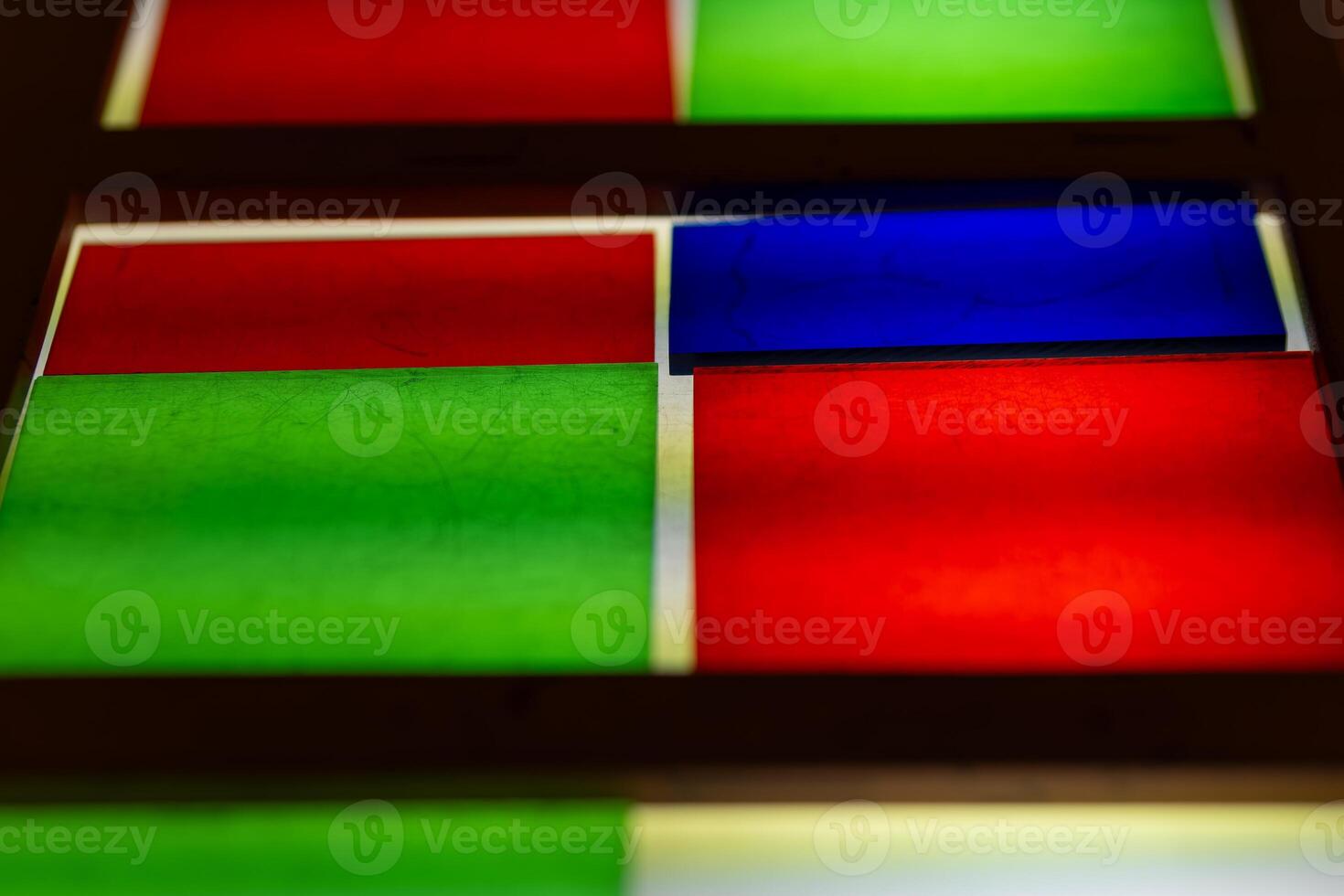 Colorful stained glass panels showcase vibrant patterns in architectural design photo