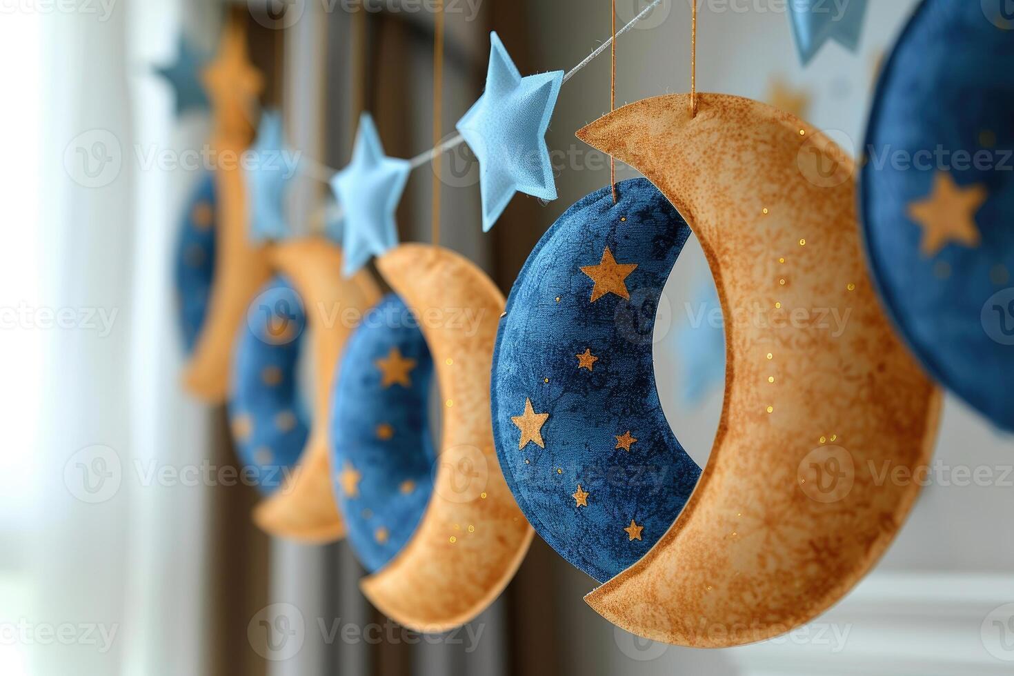A blue and gold baby shower decoration with a moon and stars photo
