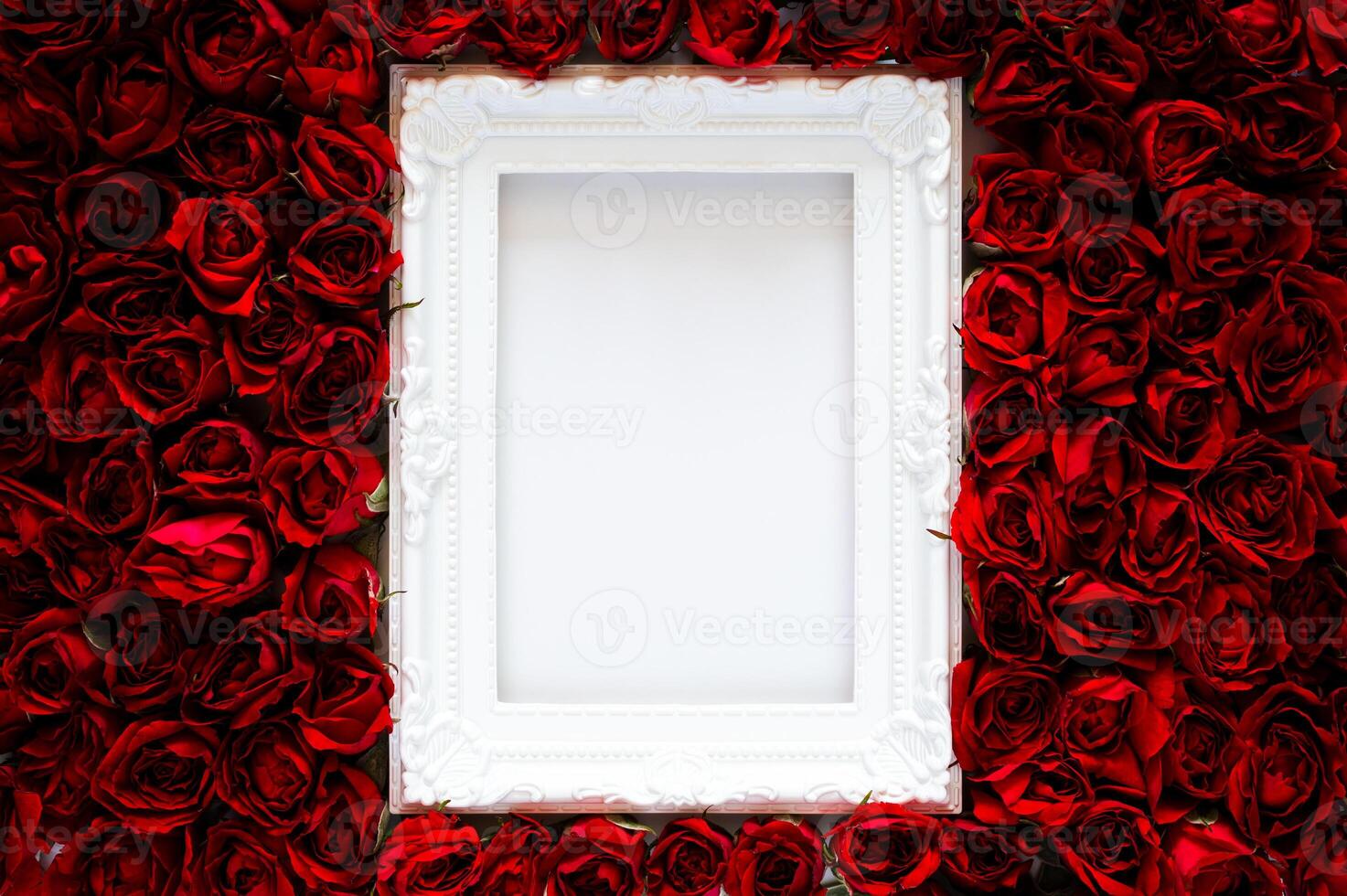 White photo frame that have white background on red roses for Valentine's and Mother day concept.