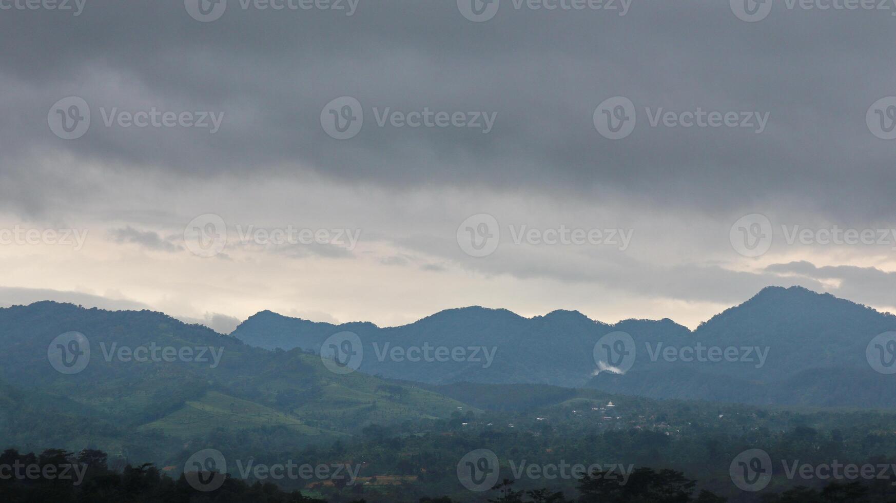 Beautiful view nature mountains clouds grey sky photo