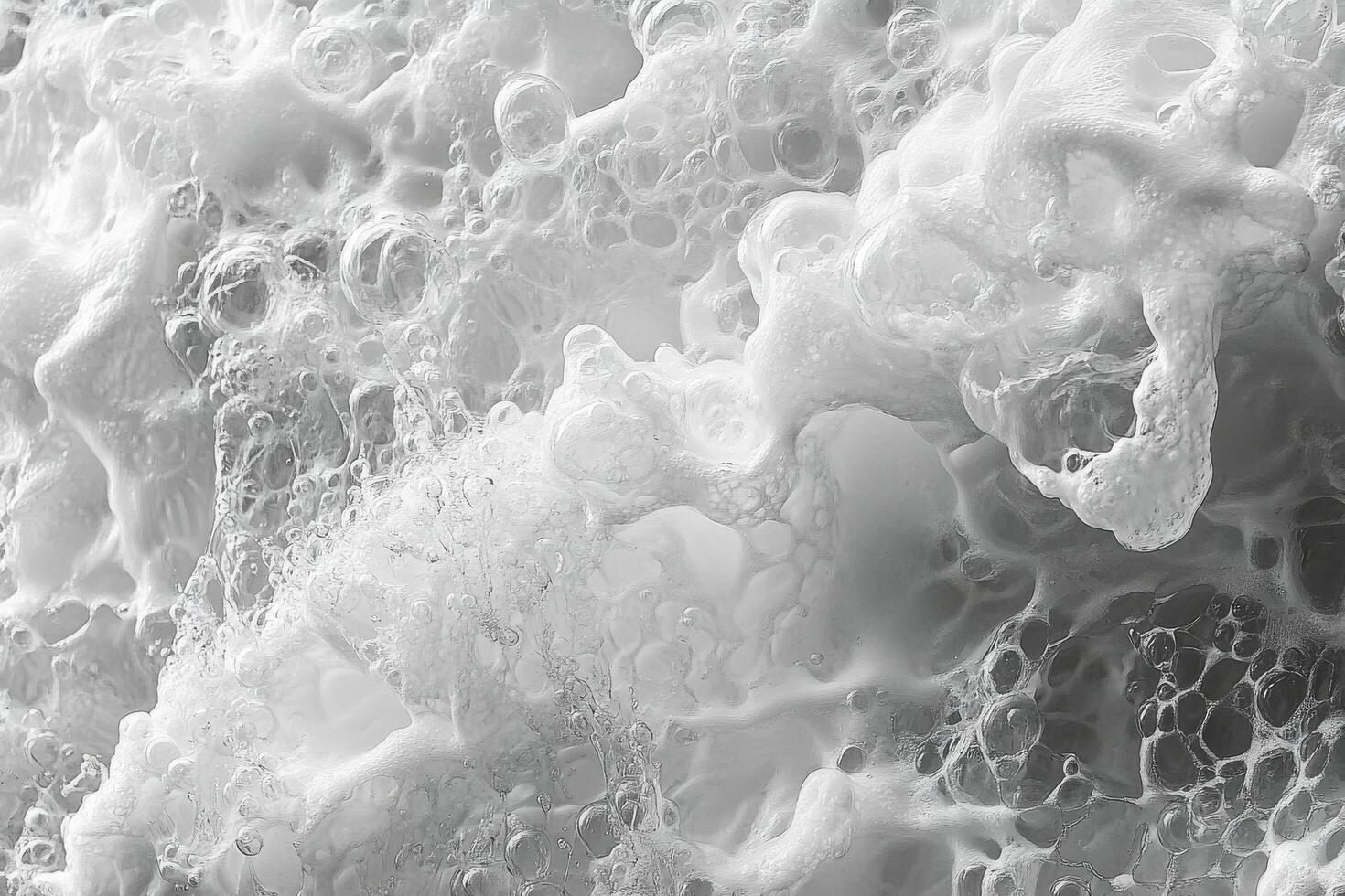 Intricate patterns of coffee foam swirling in a cup reveal rich textures and colors in warm tones photo