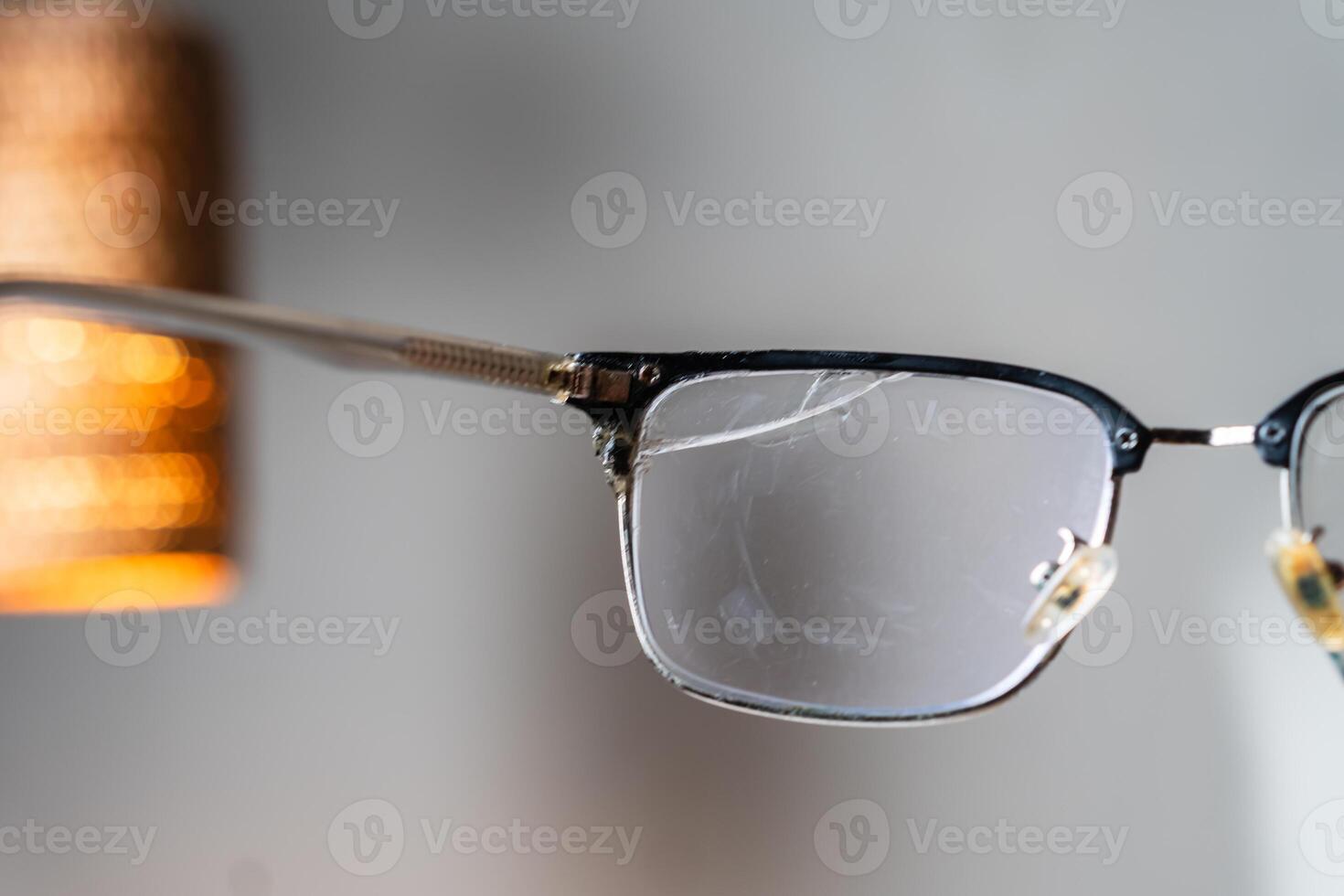 Close-Up of Cracked Eyeglasses photo