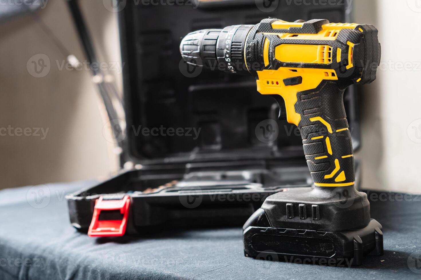 Yellow and Black Cordless Drill on Table photo