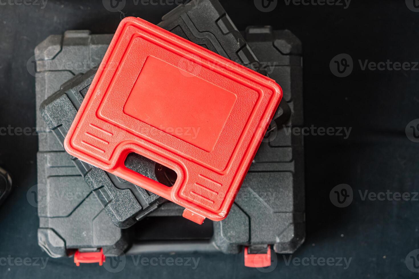 Stack of Tool Cases with Red Toolbox photo