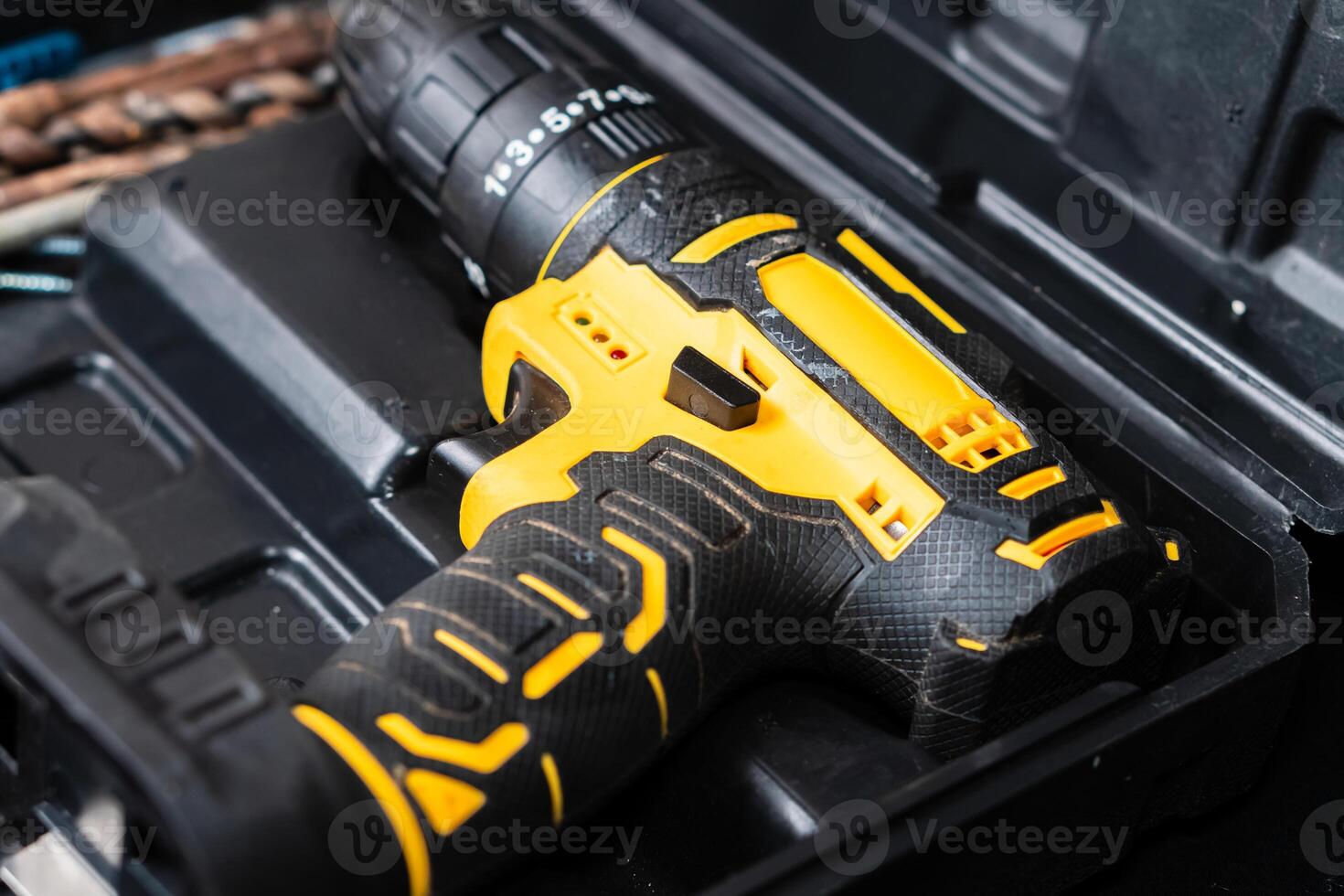 Close-up of a Yellow and Black Cordless Drill in Tool Case photo