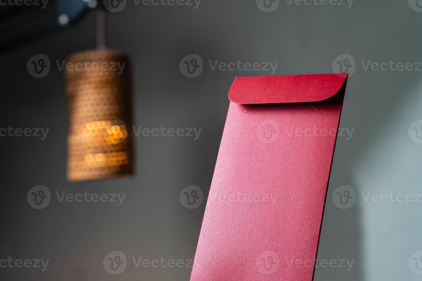 Elegant Red Envelope with Warm Lamp Background photo