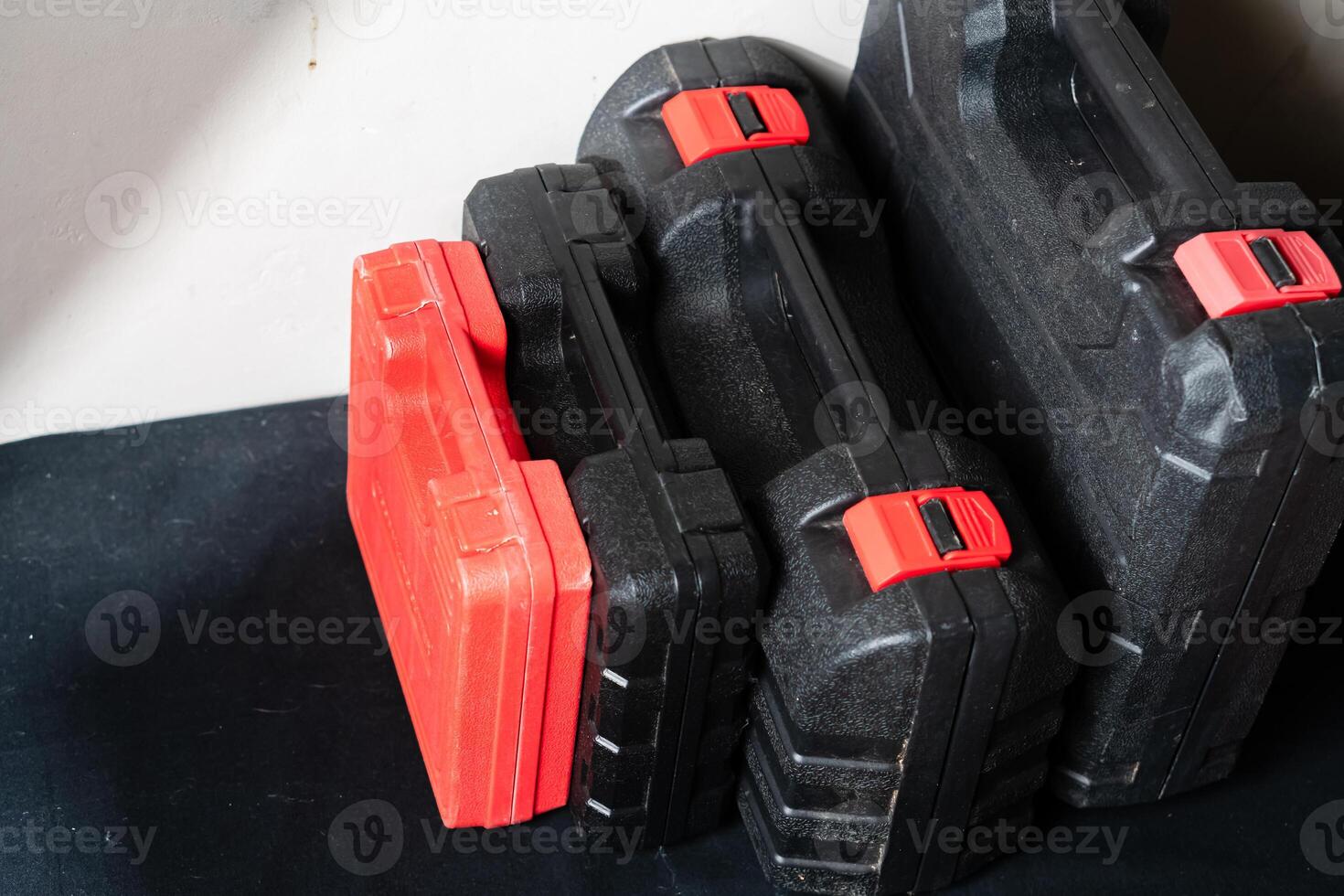 Stacked Black and Red Tool Cases photo