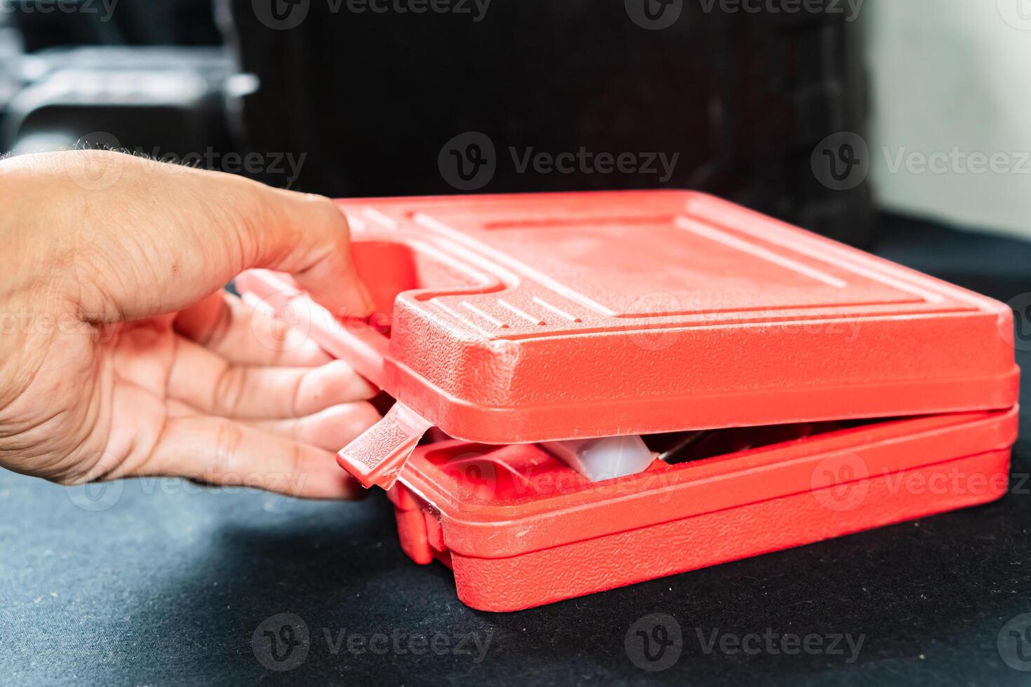 Hand Opening Red Toolbox photo