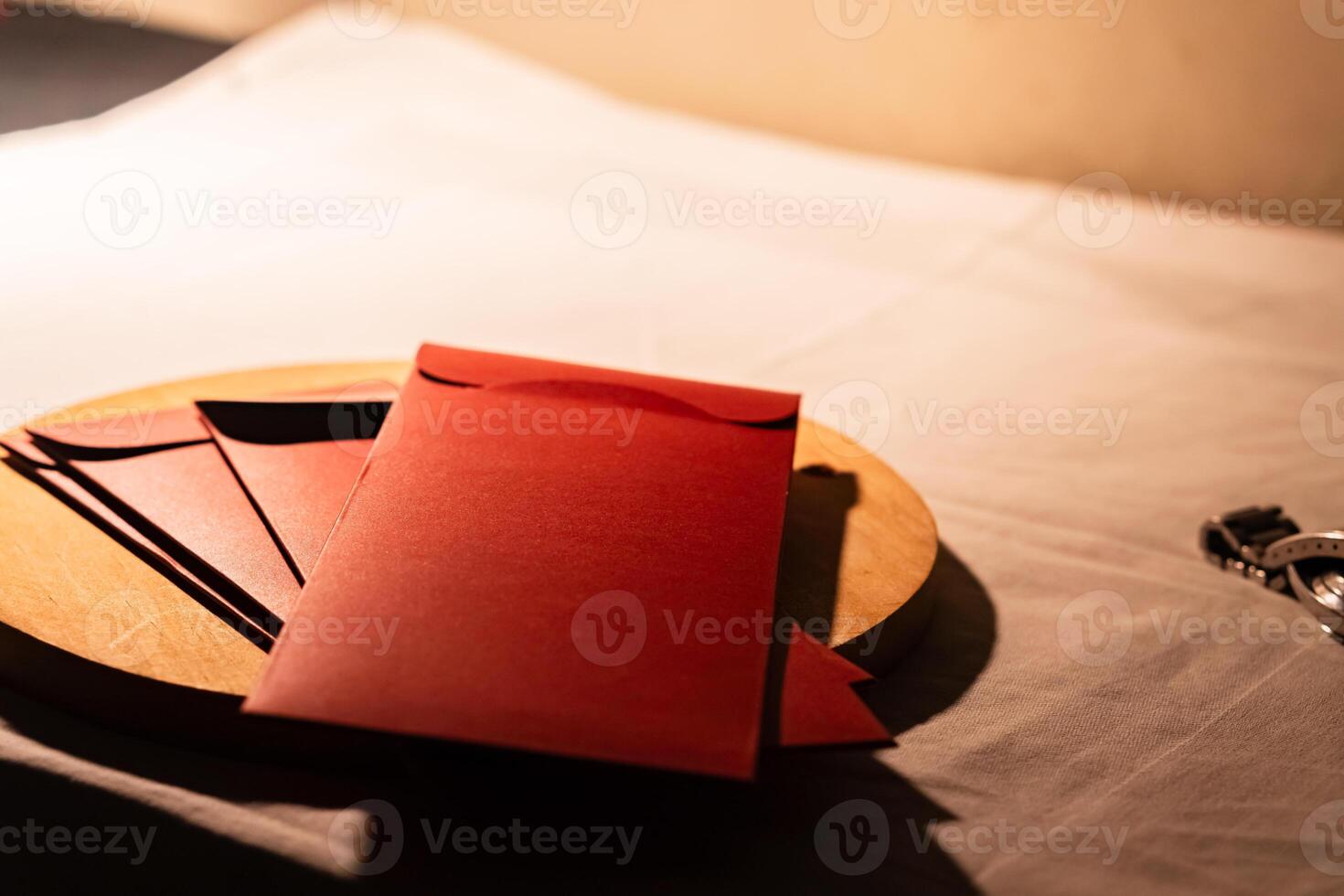 Red Envelopes on Wooden Plate photo