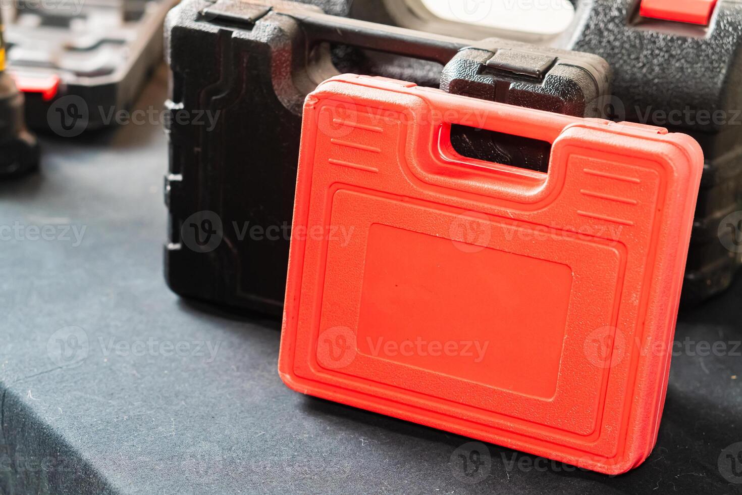 Red Tool Case on Black Surface photo